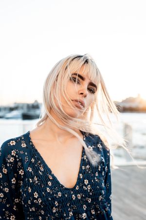 Woman looking at camera during sunrise