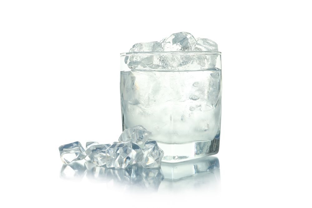 Rocks glass overflowing with ice