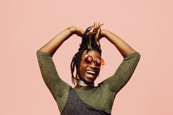 Black man laughing in studio