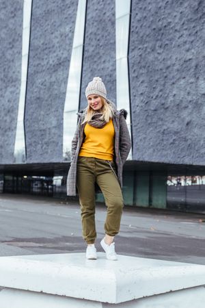 Blonde woman posing in the city