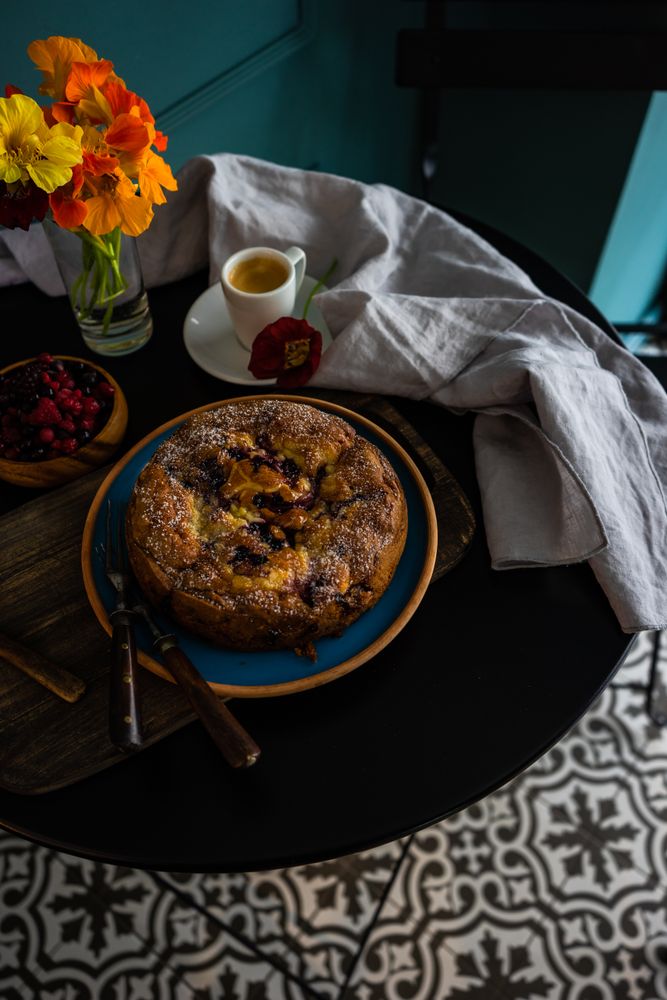 Top view of freshly baked fruit cake served with espresso