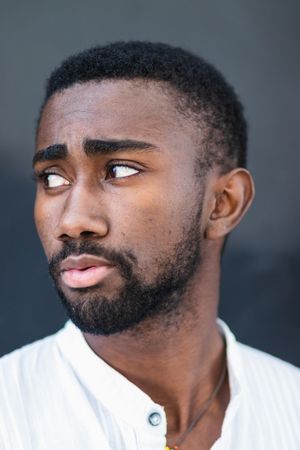 Black man in trendy clothes in city