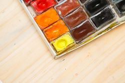 Looking down at watercolor paints, copy space