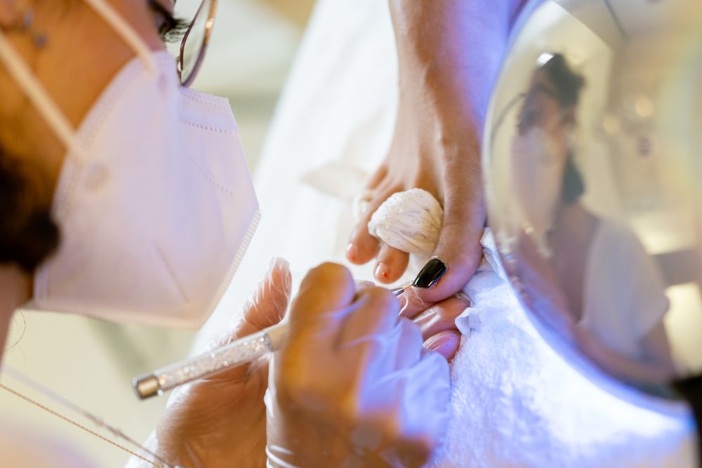 Toe nails being painted in salon
