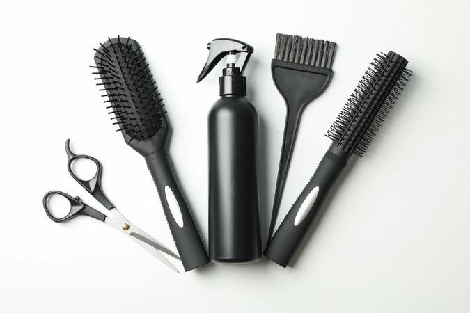 Composition with hairdresser accessories on blank background