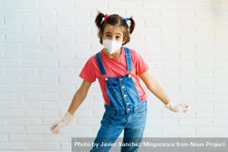 Cute girl in overalls, gloves and facemask 0gVPNb