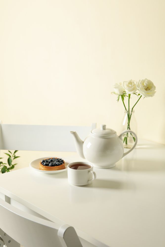 Concept of breakfast with blueberry pie on table