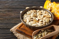 Cooking ingredients for fall season - pumpkin seeds, pumpkin