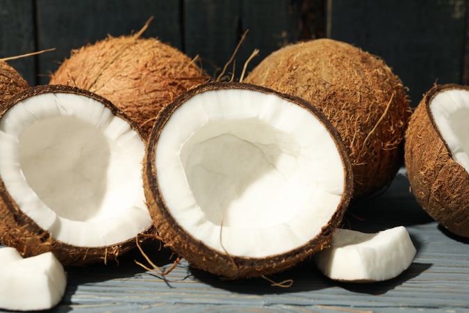 Coconut on wooden background, close up. Tropical fruit