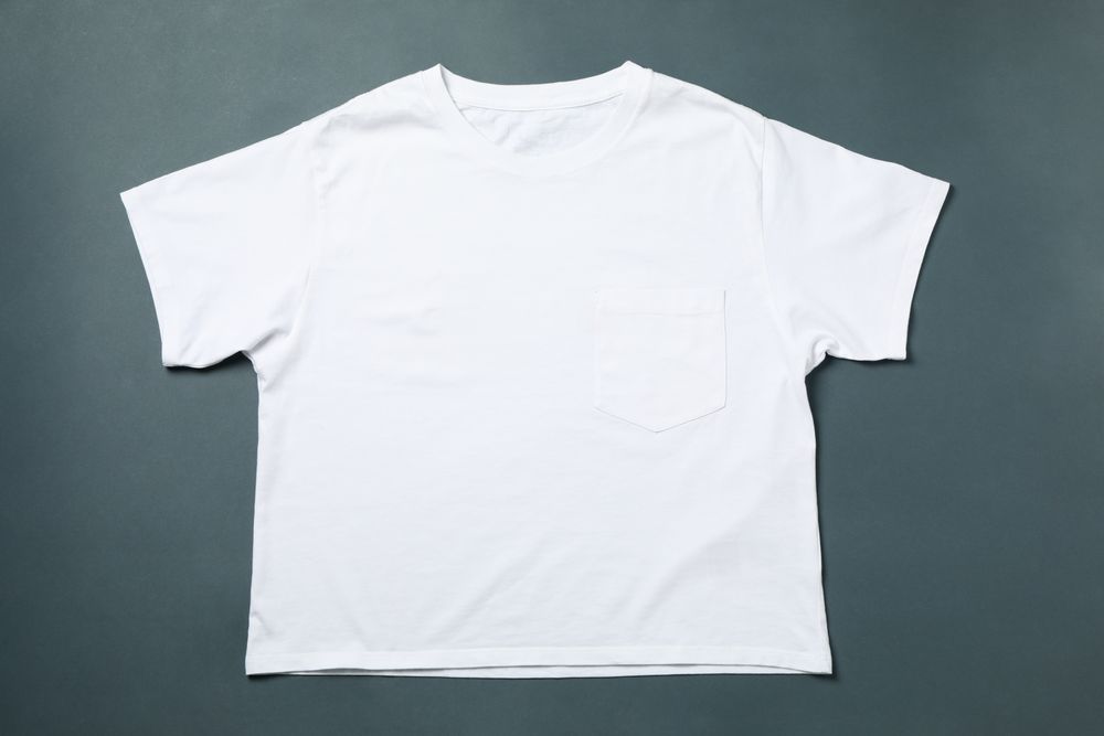Blank t-shirt on light dark background, space for text