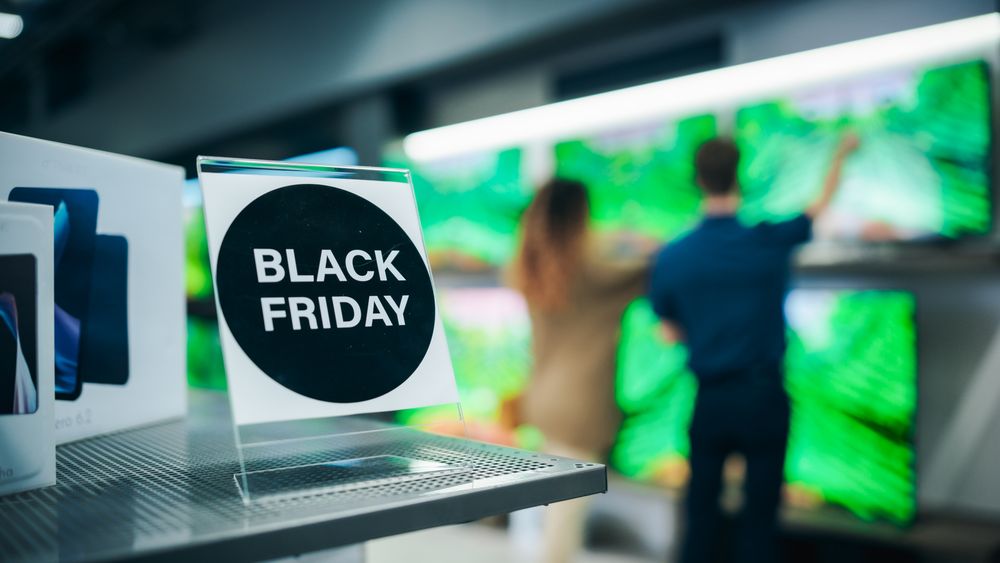 Shoppers Explore Discounted Home Appliances in a Busy Retail Storefront Showroom