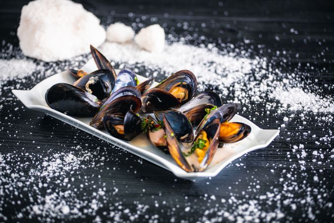 Steamed mussels with Thai sauce in plate