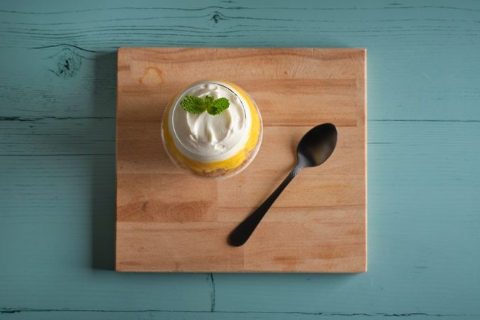 Delicious cheesecake in glass on table