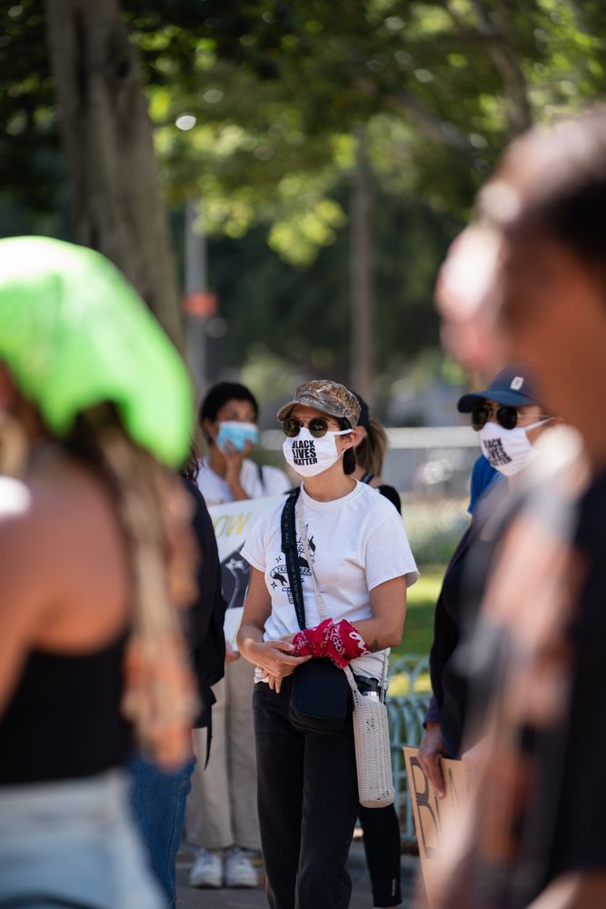 Los Angeles, CA, USA — June 16th, 2020: woman stands in crowd at protest rally