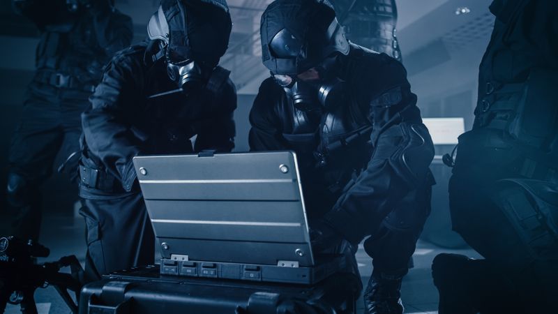 Soldier Opens a Laptop Computer to Plan a Tactical Attack.