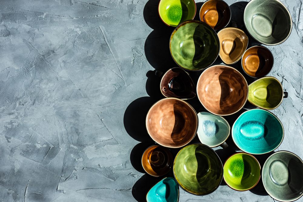 Top view of colorful empty bowls with copy space