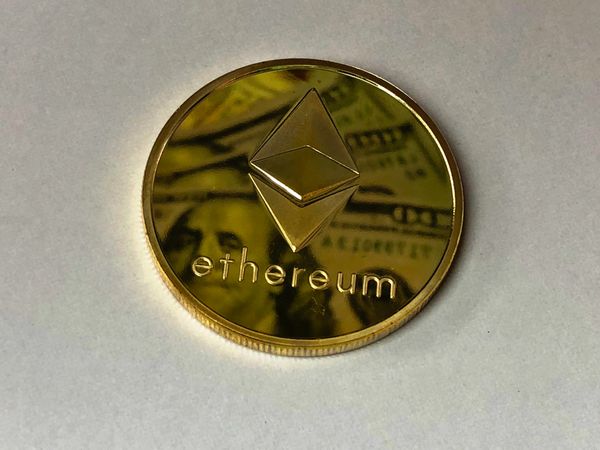 Ethereum coin on light background