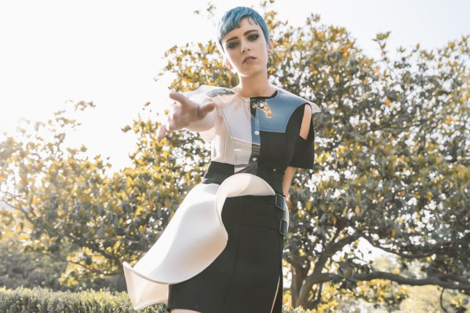 Futuristic woman reaching out camera