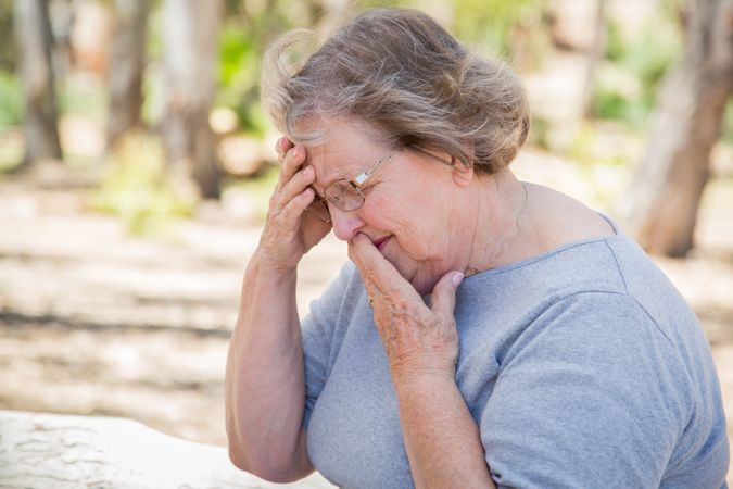 Upset Mature Woman Sitting Alone