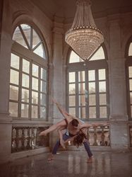 Bended dancer with ballerina on back in palace