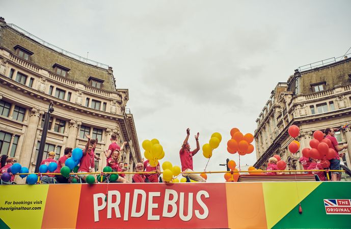 London, England, United Kingdom - July 7th, 2019: Revelers pictured atop the Pride Bus in London