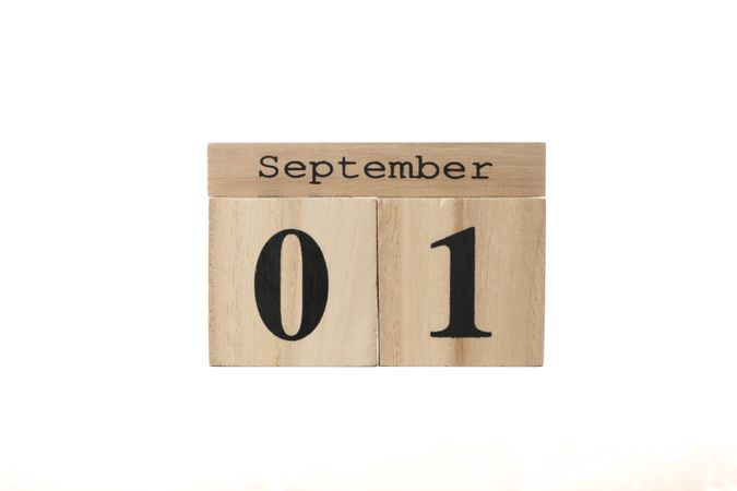 Wooden calendar with date September 1 isolated on neutral background