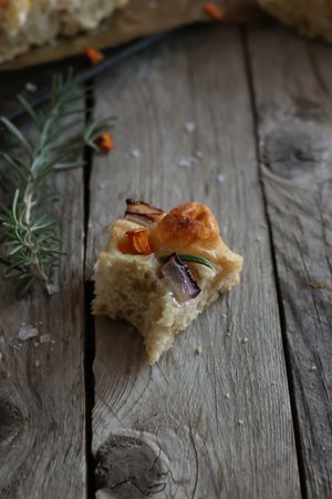Pieces of fresh focaccia on wooden table