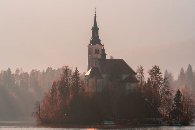 Lake Bled Church on foggy mornind day of December