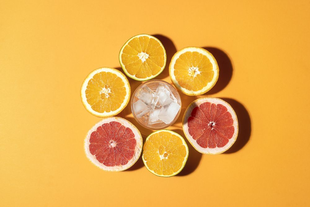 Citrus fruits and glass ready for a summer drink