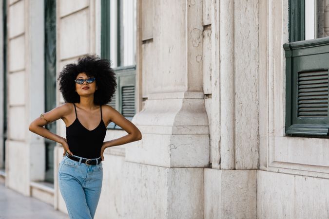 Cheerful Black female in dark sunglasses