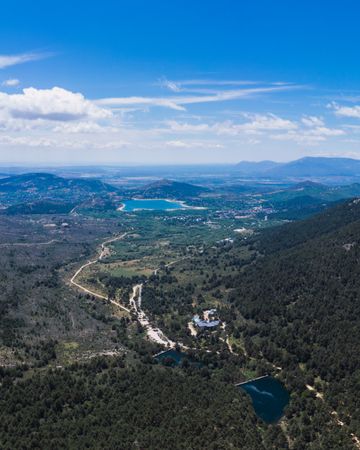 Landscape of blue lakes surrounded by greenery and rocks