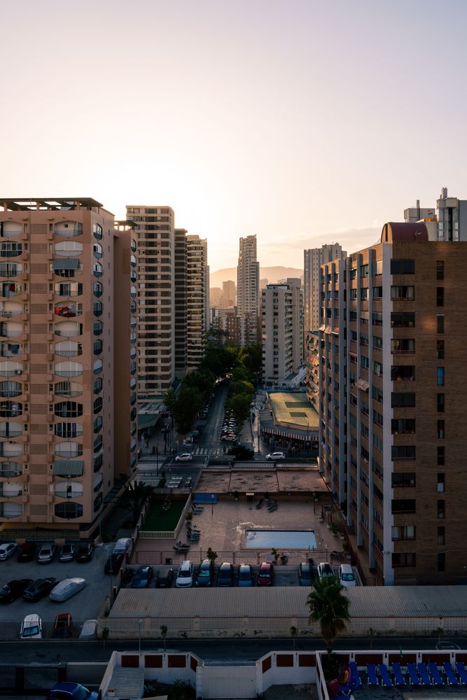 Residential buildings against sunset sky