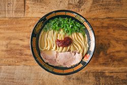 Tasty ramen with pork slices and salsa