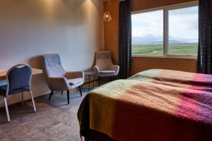 Comfortable hotel room with rural view from window