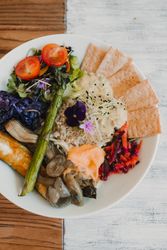 Appetizing vegetable and bread snacks on plate
