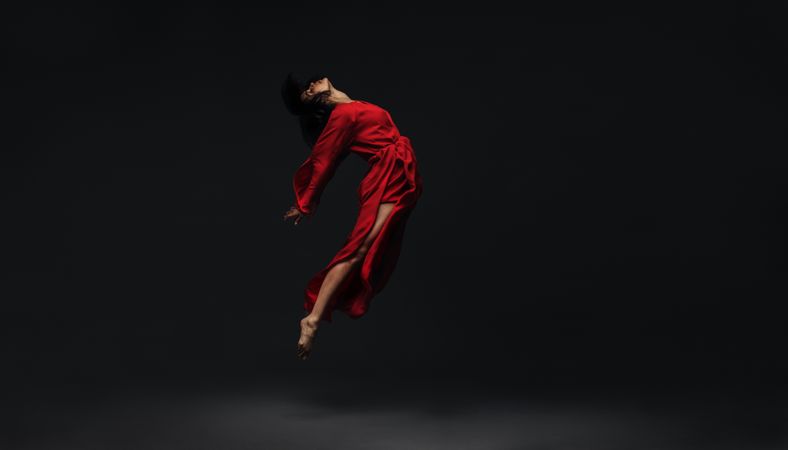 Contemporary dancer dancing on studio background