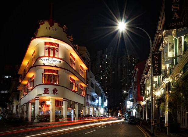 Time lapse photography of car in Chinatown Singapore at night