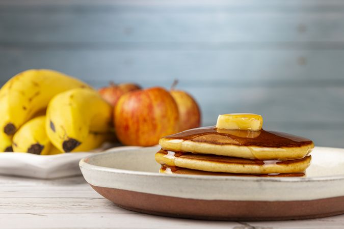 Delicious pancakes with butter and honey.
