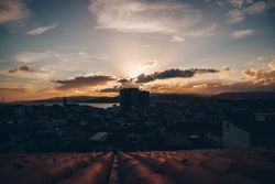 Cityscape near water and beautiful sky in evening