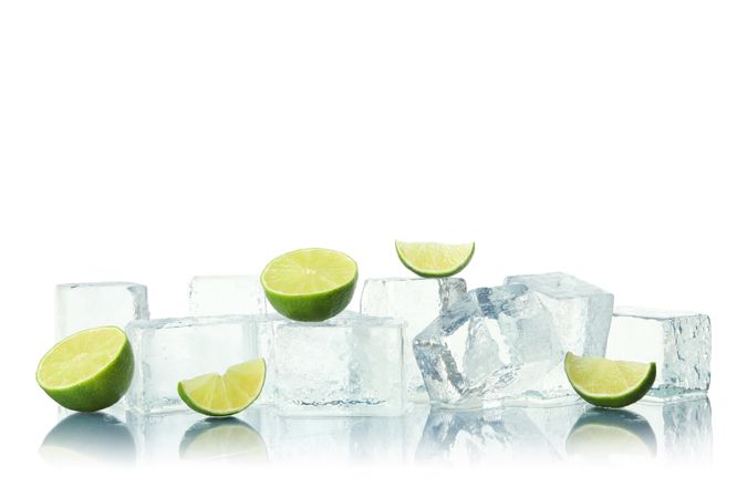 Ice cubes and slices of lime, copy space