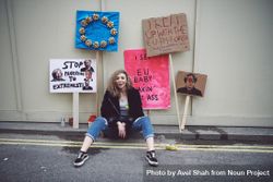 London, England, United Kingdom - March 23rd, 2019: Woman sitting with pro-EU political signs bE9J6b
