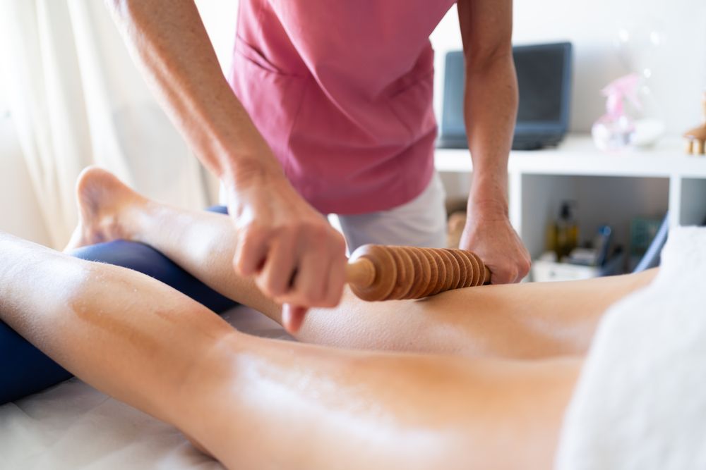 Woman receiving leg massage