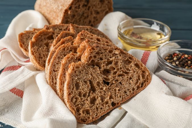 Composition with freshly baked bread on wooden background, closeup and space for text