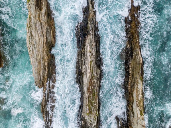 Stone ridges on high seas in stormy day