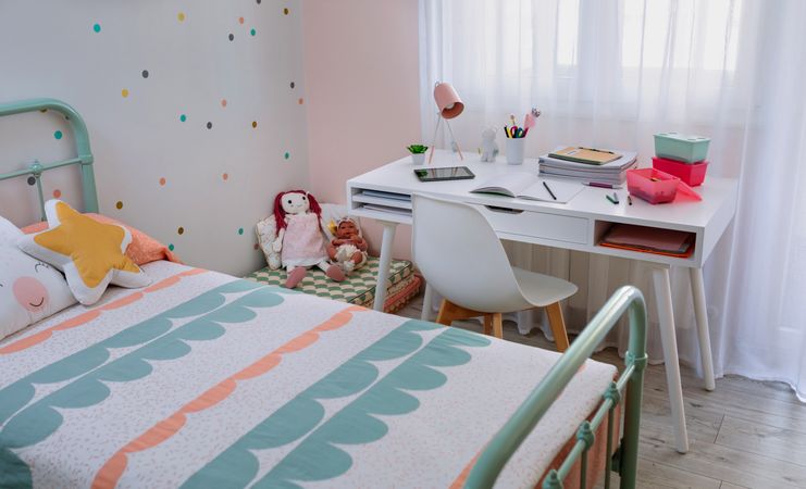 Girl's bedroom decorated in pastel colors