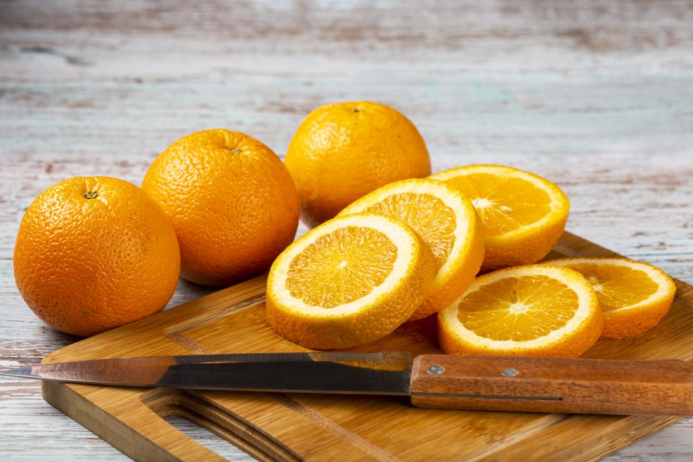 Sliced oranges on the table.