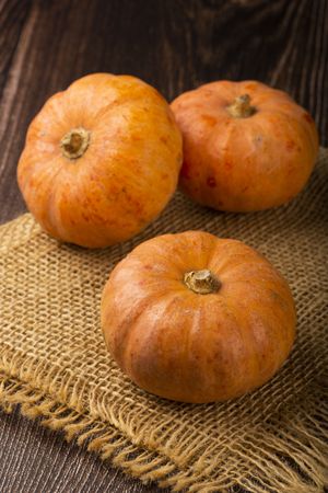 Pumpkins on the wooden table.