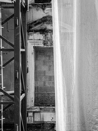 Builder's curtain partially covering window of Villa's facade on Blvd d'Italie, Monaco