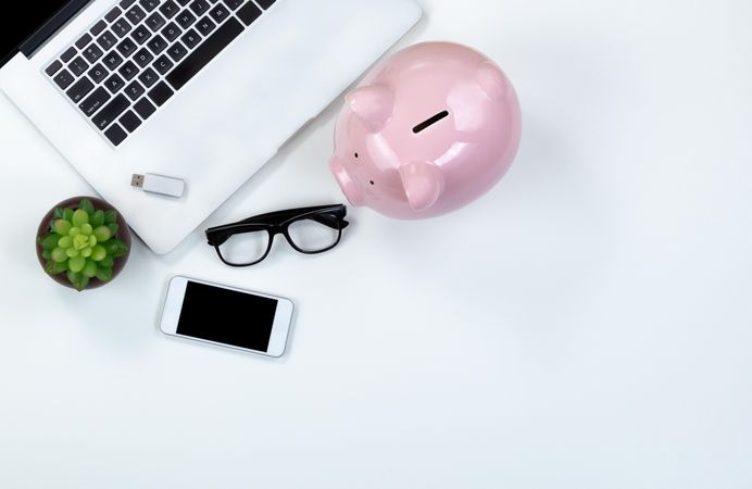 Desktop with piggy bank for investment concept
