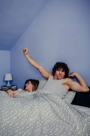 Man waking up while his wife sleeps